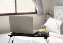 work-home-bed-table-laptop_istock
